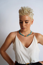House of Sól Bébé Duo styled on model — Biwa pearl and turquoise necklaces layered with Bébé Lock
