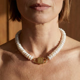  Fahrelnissa freshwater disc pearl necklace with House of Sól gold lock clasp, worn by brunette model with bob cut.