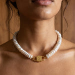 Fahrelnissa stacked coin pearl necklace styled on model with long dark hair, featuring House of Sól signature clasp.