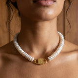 Fahrelnissa stacked coin pearl necklace styled on model with long dark hair, featuring House of Sól signature clasp.