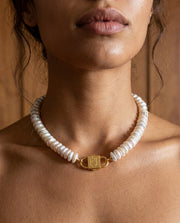 Fahrelnissa stacked coin pearl necklace styled on model with long dark hair, featuring House of Sól signature clasp.