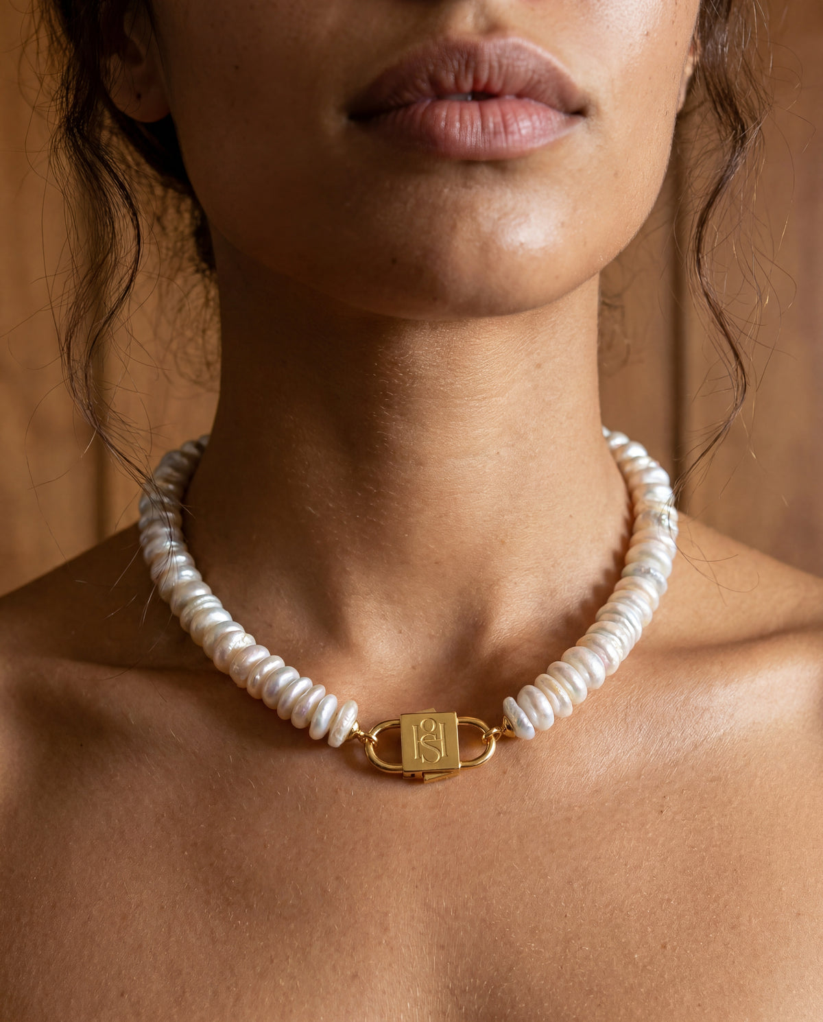 Fahrelnissa stacked coin pearl necklace styled on model with long dark hair, featuring House of Sól signature clasp.