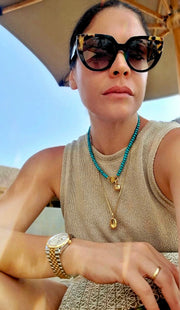 Bebe Turquoise necklace with HoS Lock in a parasol-shaded selfie, plus a small charm and pendant chain