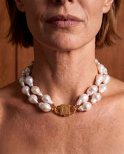 Double Ostrea two-strand baroque pearl necklace with a gold-tone HoS Lock, worn on model