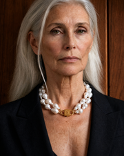 Double Ostrea two-strand baroque pearl necklace with HoS Lock on a model in a black blazer