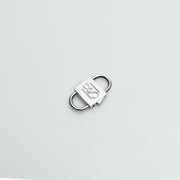 HoS Lock in white gold finish on sterling silver, shown closed on a white backdrop