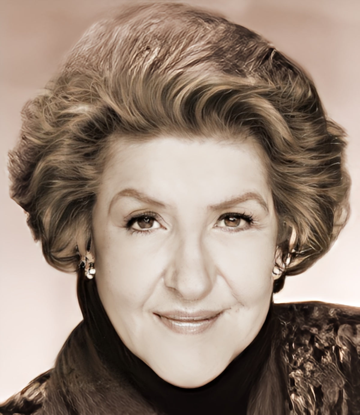 Sepia-toned vintage portrait of a smiling woman with voluminous hair and a dark turtleneck