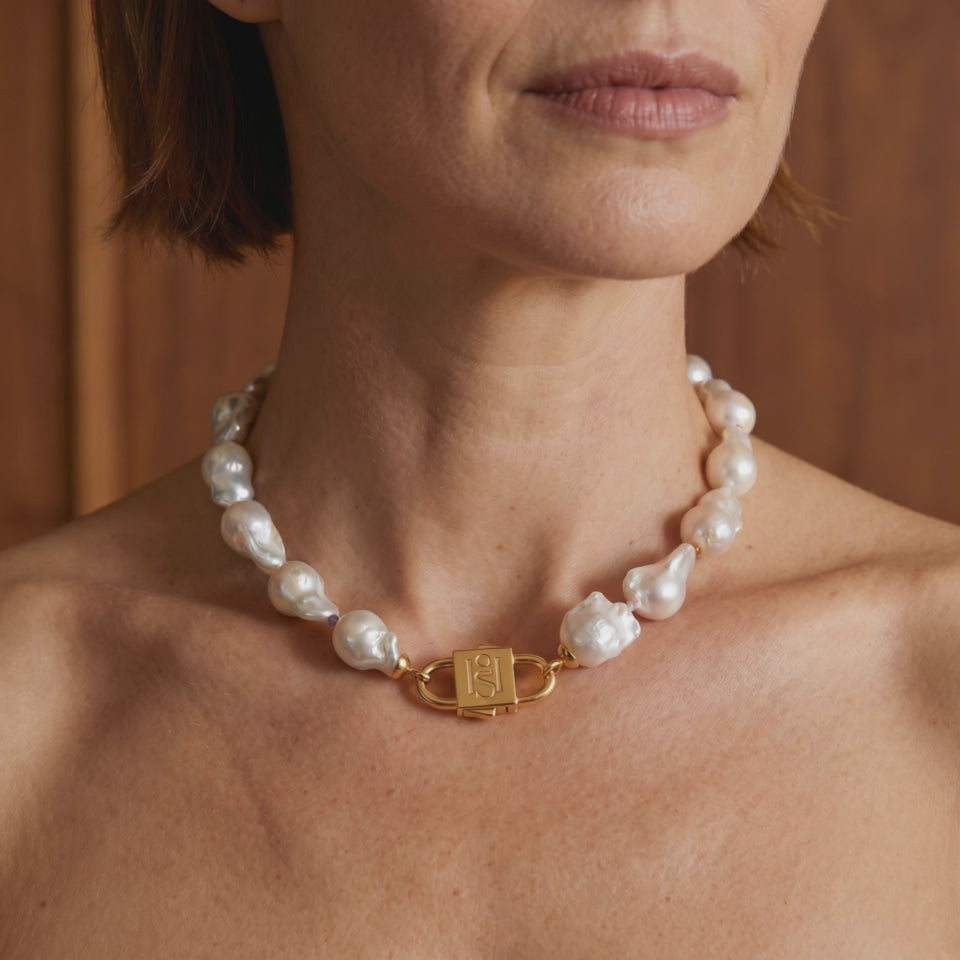 House of Sól Ostrea baroque pearl necklace worn with the Signature HoS Lock™.