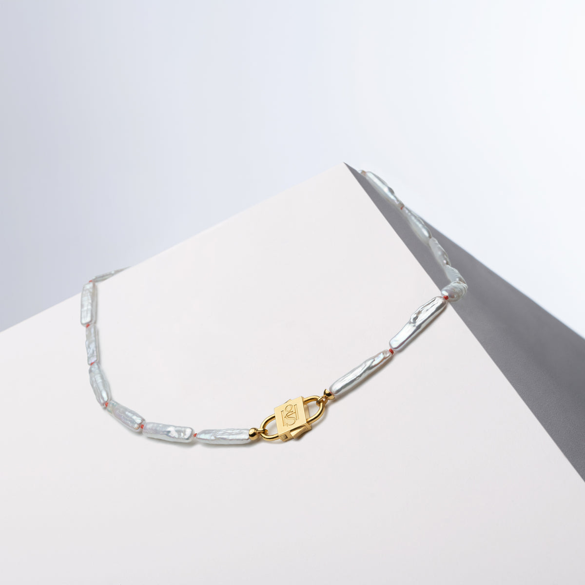 Hand-knotted Biwa freshwater pearl necklace with Bébé Lock closure — House of Sól Bébé Blanc