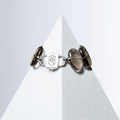 Fluxes smoky quartz bracelet with silver-tone HoS Lock at the center on a white pyramid