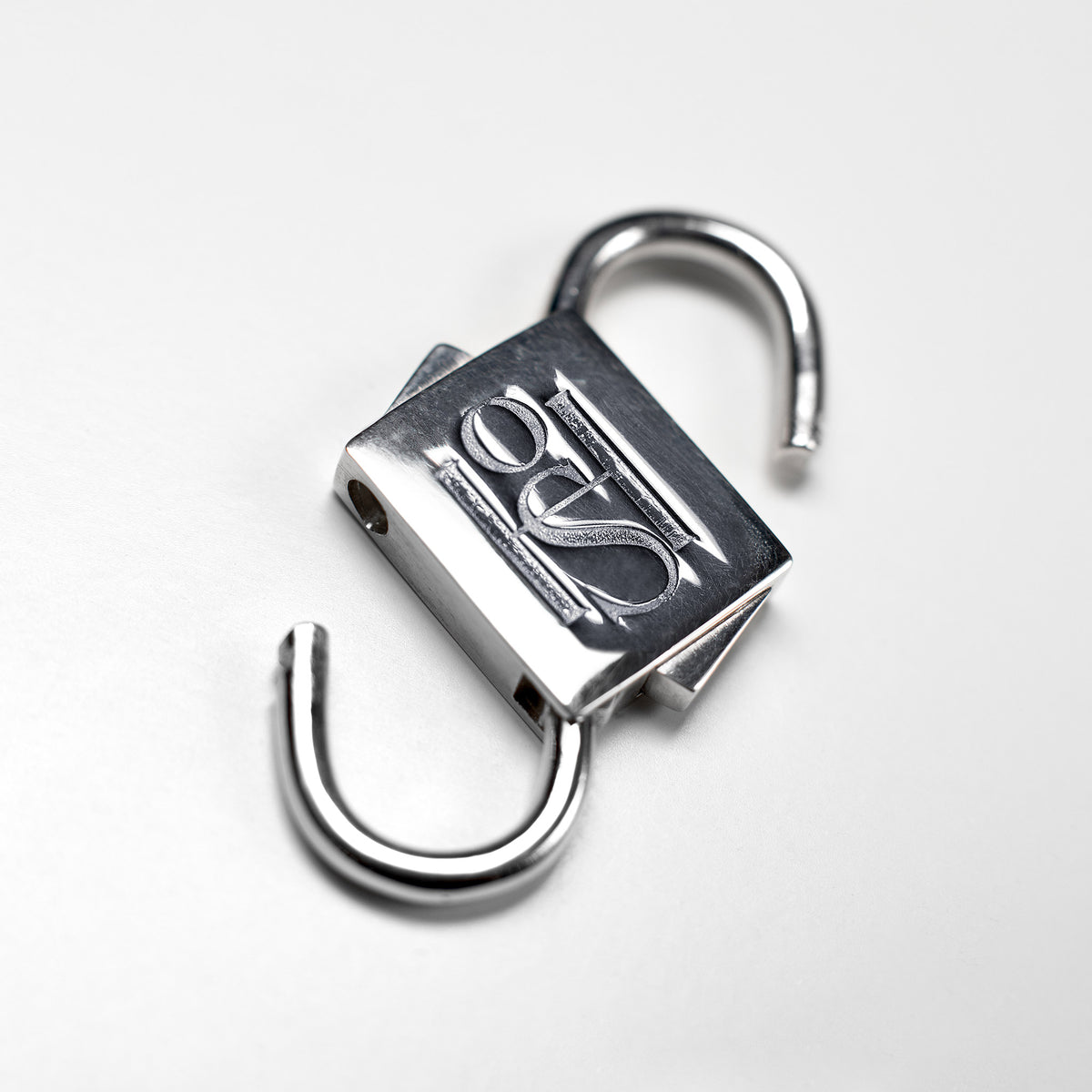 Silver-tone HoS Lock shown open with both shackles released on a white background