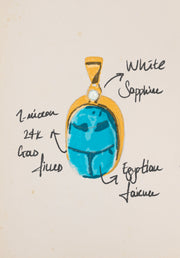 Hand-drawn sketch of the Scarab charm with handwritten notes naming white sapphire, gold-filled metal and Egyptian faience