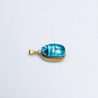 Scarab charm of blue Egyptian faience set in gold-filled sterling silver, seen from above