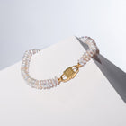 Fahrelnissa pearl necklace with a gold  House of Sol clasp, named after the artist Fahrelnissa Zeid, displayed on a white surface.