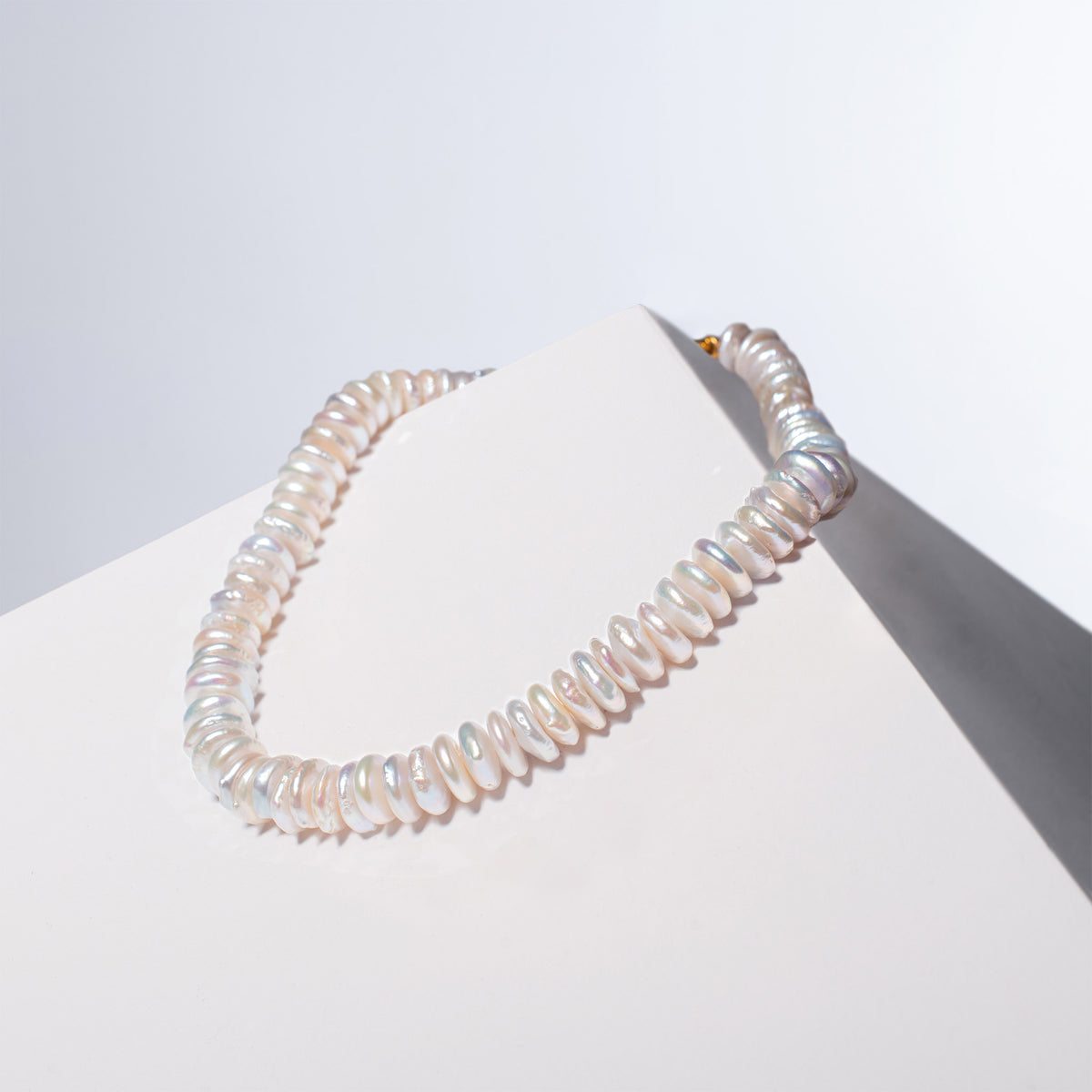 Fahrelnissa pearl necklace, named after the artist Fahrelnissa Zeid, displayed on a white surface.